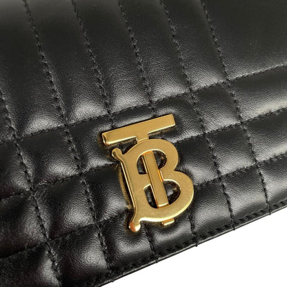 Burberry black and gold quilted leather small Lola shoulder bag with logo detail.