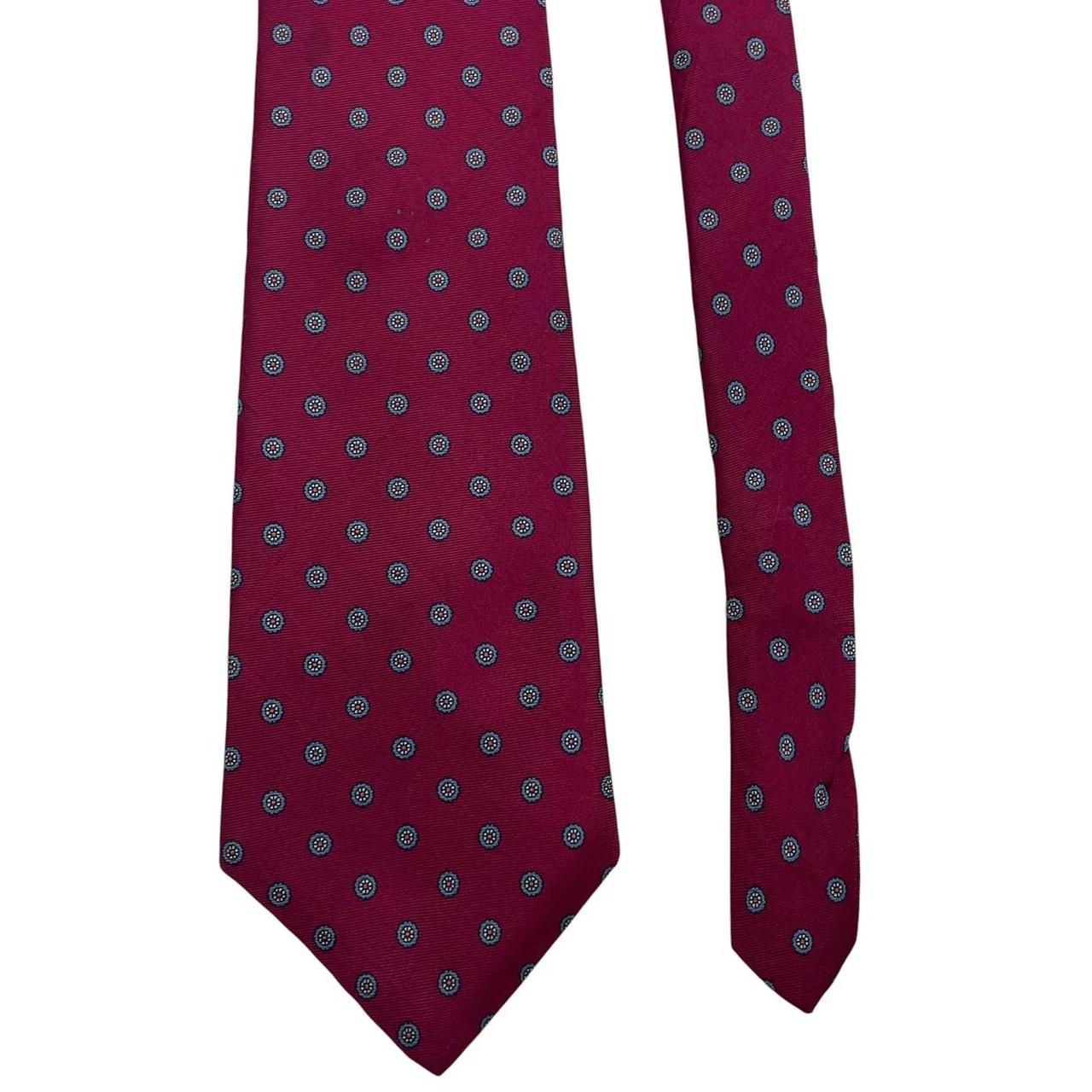 Christian Dior burgundy silk tie with subtle sheen and vintage charm.