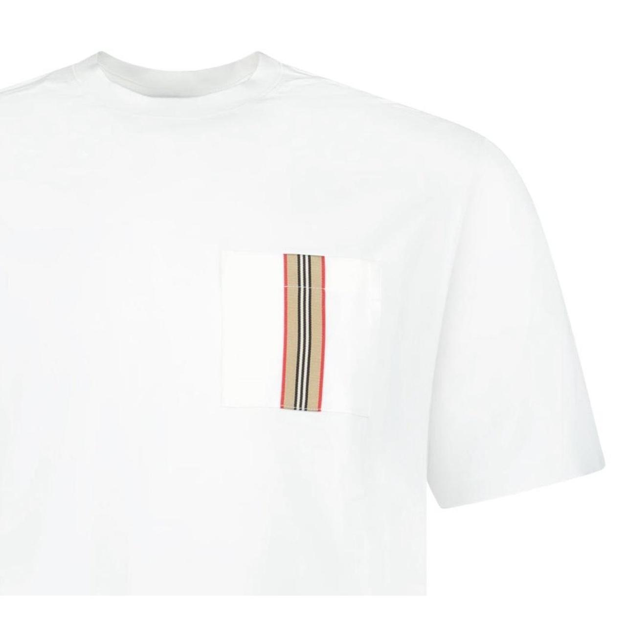 Burberry white pocket t-shirt with embroidered logo and striped detailing.