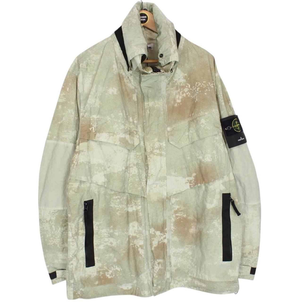 Stone Island green full zip jacket with dissolving grid camo pattern and logo patch.