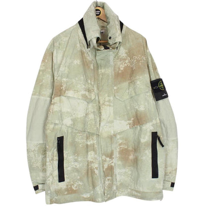 Stone Island green full zip jacket with dissolving grid camo pattern and logo patch.