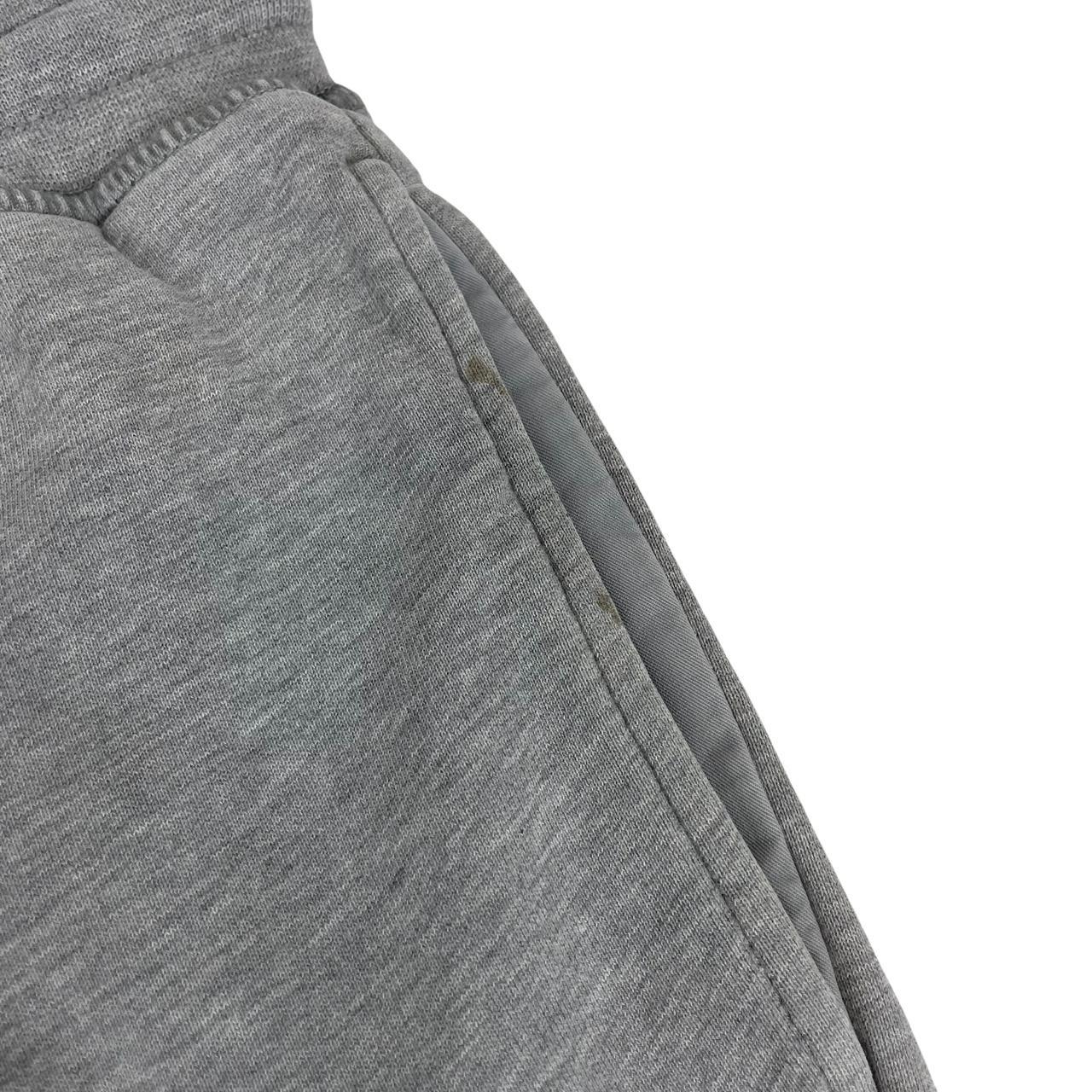 Stone Island grey joggers with logo patch and cotton material, size small.