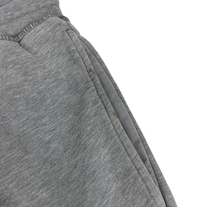Stone Island grey joggers with logo patch and cotton material, size small.