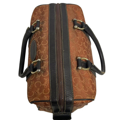 CELINE orange duffel bag with Macadam canvas and leather, visible wear and discolouration.