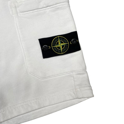 Stone Island white jogger shorts with logo patch and cotton material.