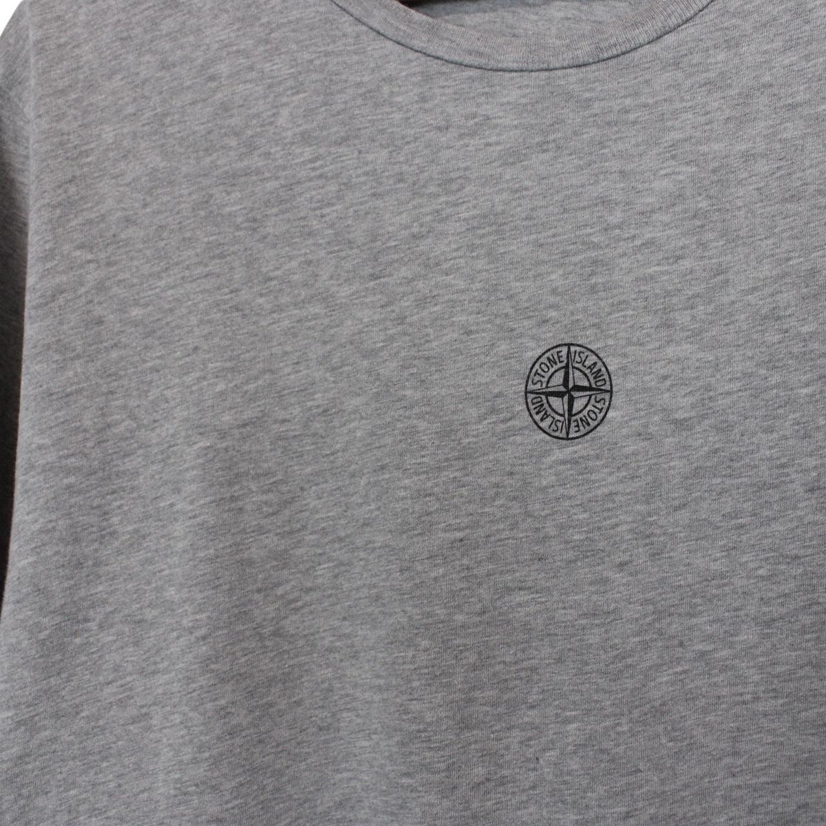Stone Island grey short sleeve cotton t-shirt with logo print and visible stains.