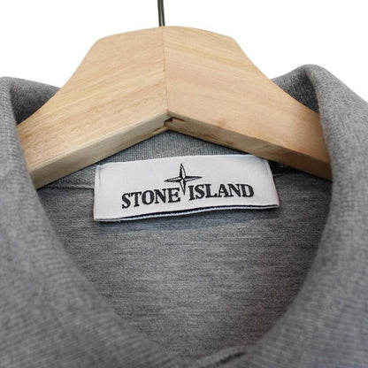 Stone Island grey long sleeve polo shirt with embroidered compass logo and slim fit.
