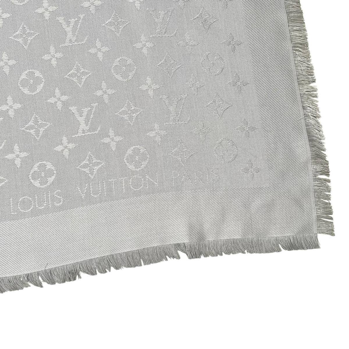 Louis Vuitton grey shawl scarf with LV monogram pattern in silk and wool blend.