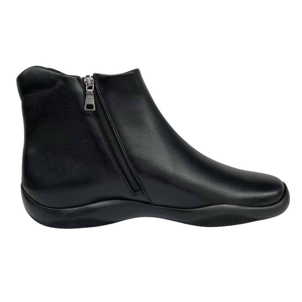 Prada black calfskin leather ankle boots with logo detail and original dust bags.