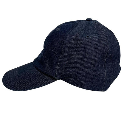 Stone Island blue denim baseball cap with diagonal twill texture and logo patch.