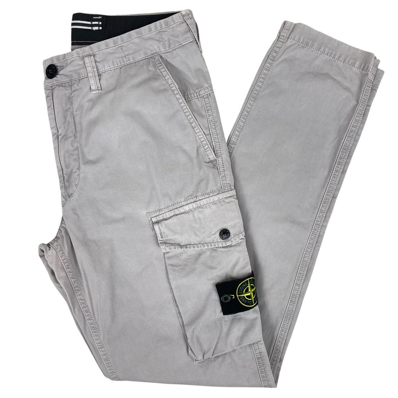 Stone Island grey cargo trousers with logo patch and slim fit design.