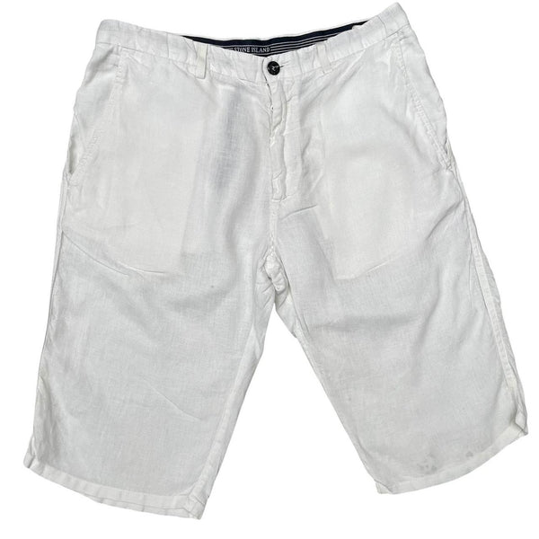Stone Island white linen Bermuda shorts with logo patch and subtle stains.