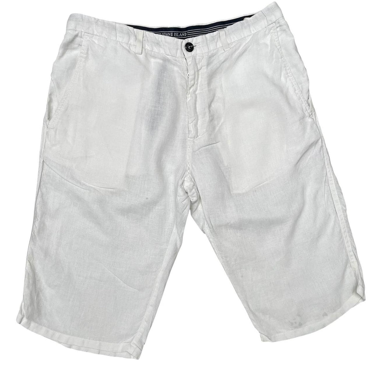 Stone Island white linen Bermuda shorts with logo patch and subtle stains.