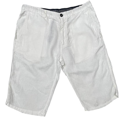 Stone Island white linen Bermuda shorts with logo patch and subtle stains.