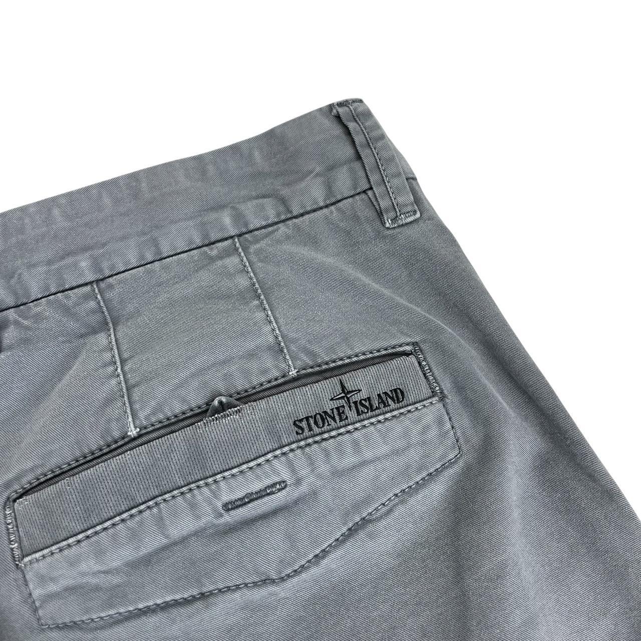Stone Island grey slim fit cotton trousers with logo patch and classic design.