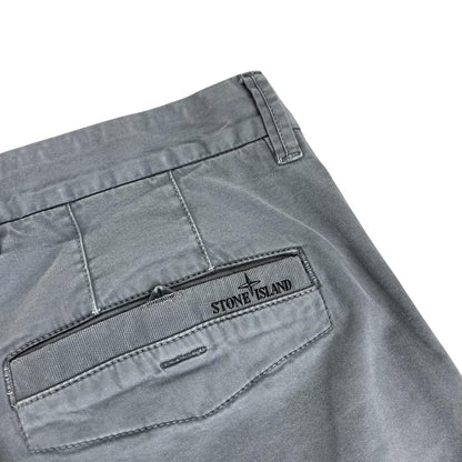 Stone Island grey slim fit cotton trousers with logo patch and classic design.
