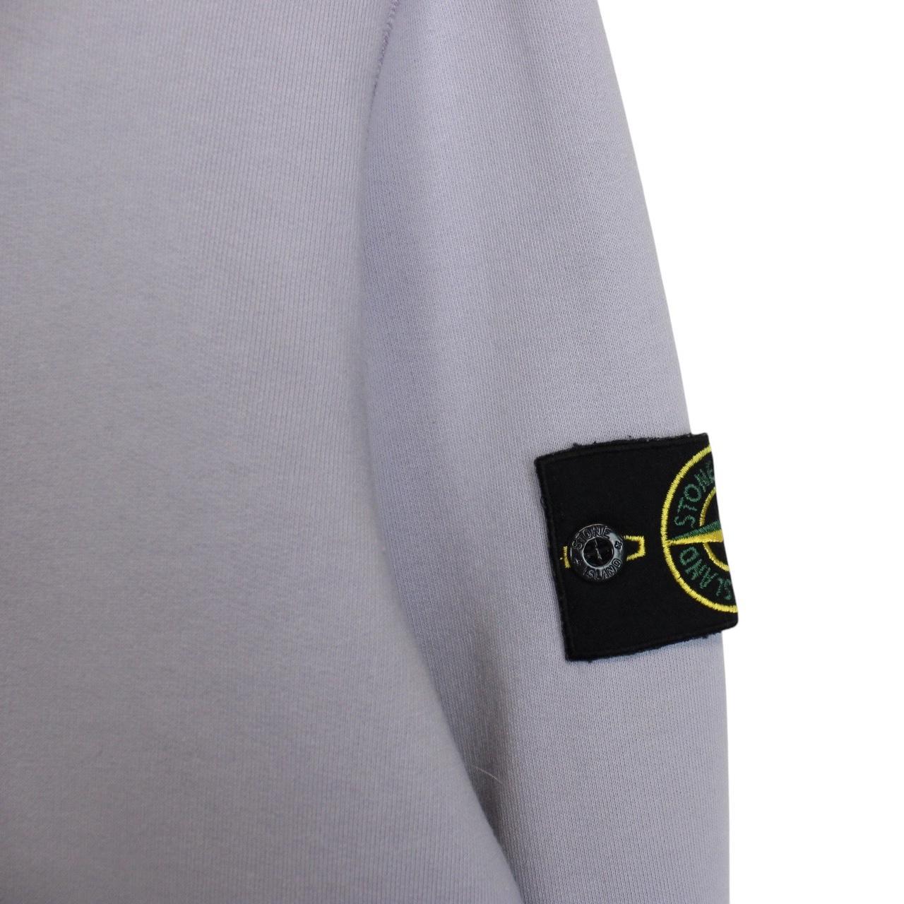 Stone Island lilac purple sweatshirt with compass logo patch and cotton material.