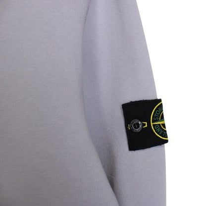 Stone Island lilac purple sweatshirt with compass logo patch and cotton material.