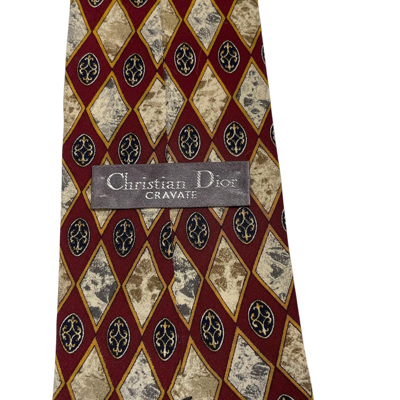 Christian Dior cream silk tie with multicoloured abstract print and logo detail.