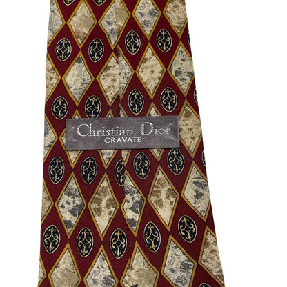 Christian Dior cream silk tie with multicoloured abstract print and logo detail.