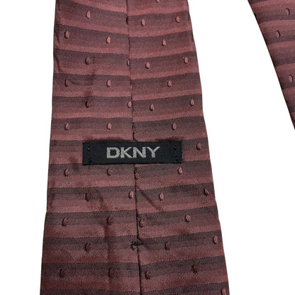 DKNY burgundy silk tie with striped pattern and logo detail.