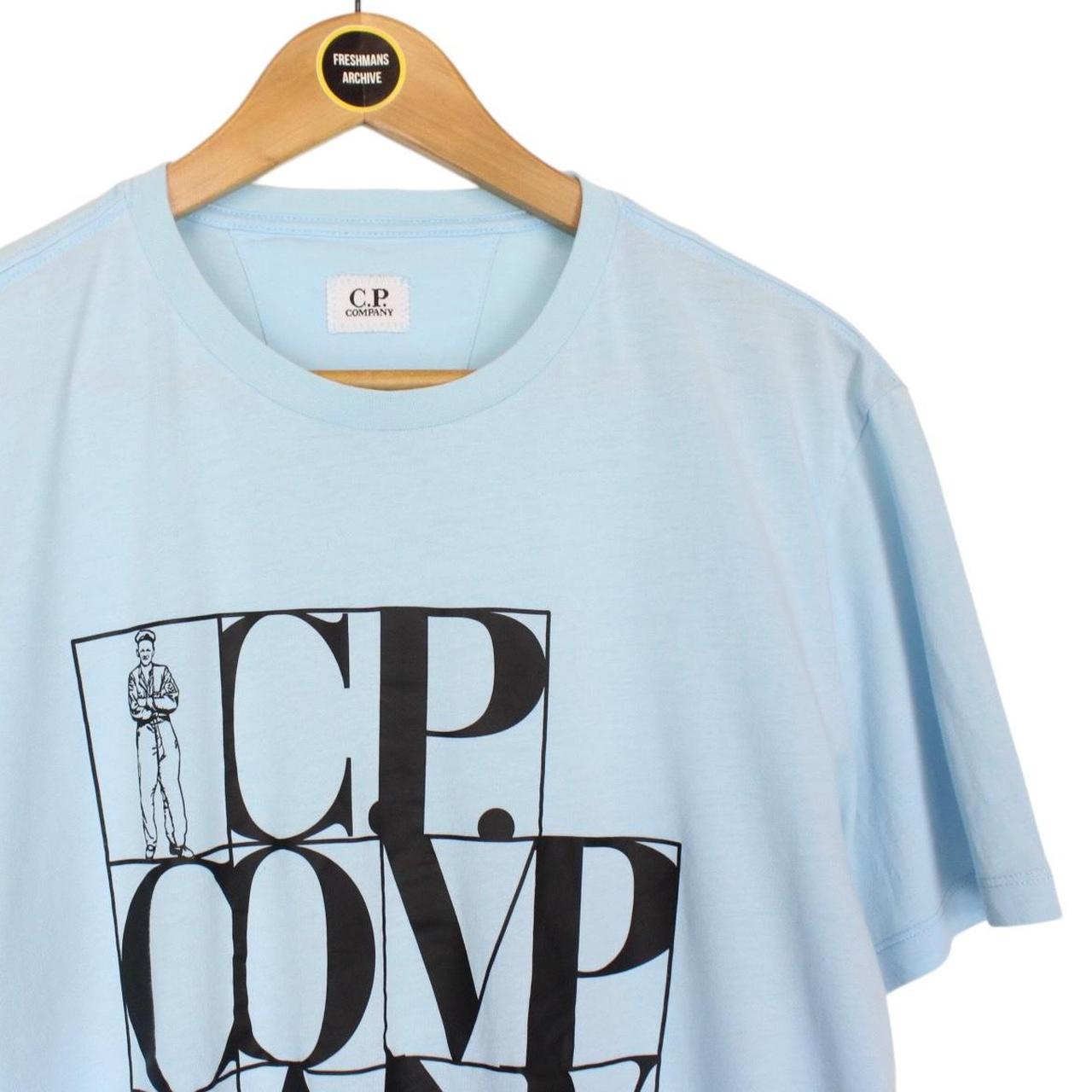 CP Company Light Blue and Black Block Man Logo Short Sleeve T-Shirt