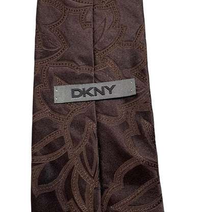 DKNY brown silk tie with vintage floral pattern and logo detail.