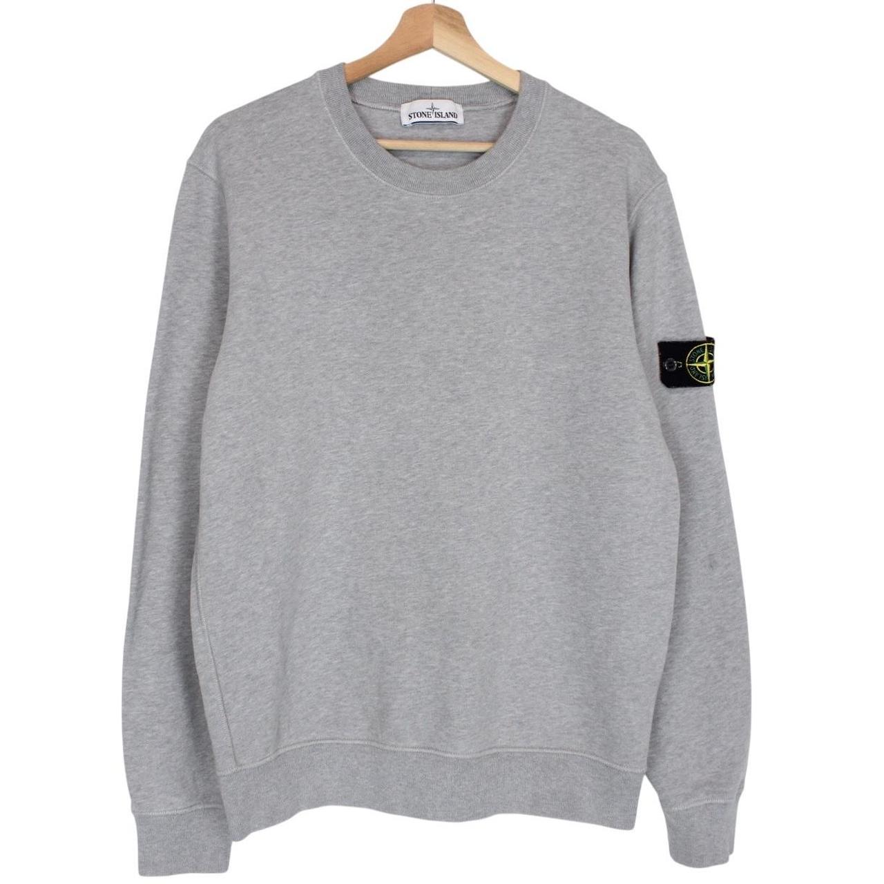 Stone Island grey cotton sweatshirt with logo patch and faint mark on sleeve.
