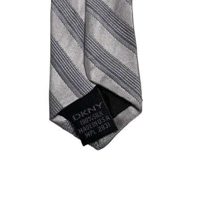 DKNY silver striped silk tie with elegant sheen and vintage design.