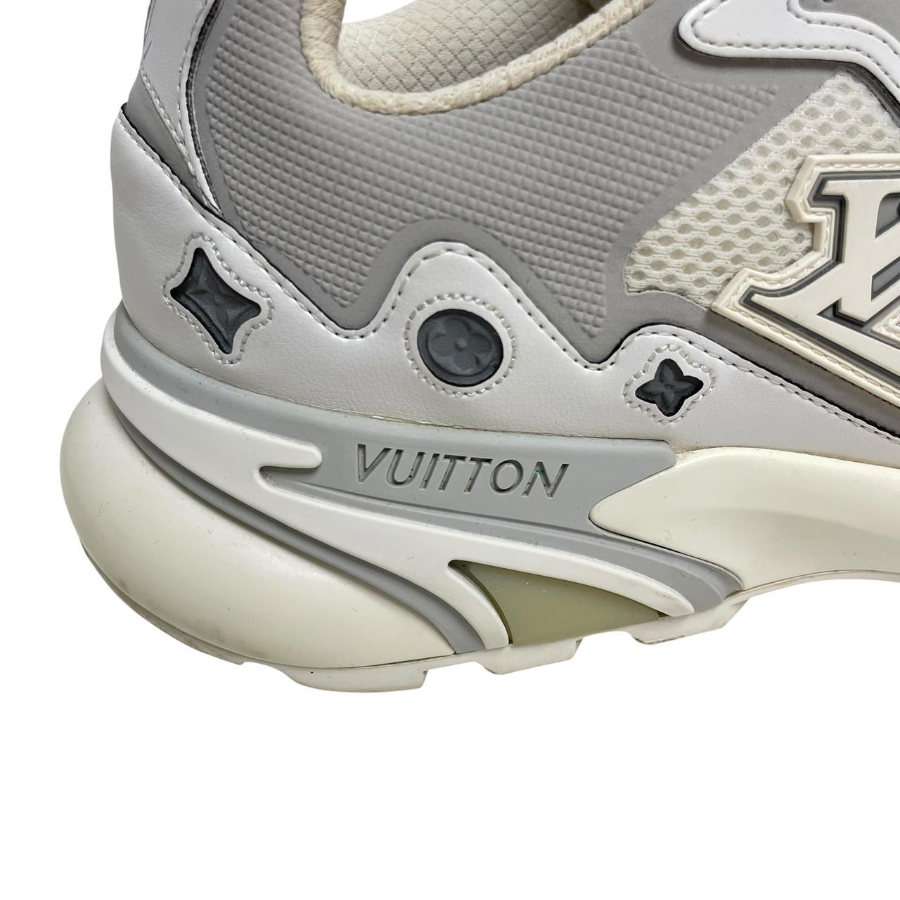 Louis Vuitton white trainers with logo detailing and sleek design, pre-owned condition.