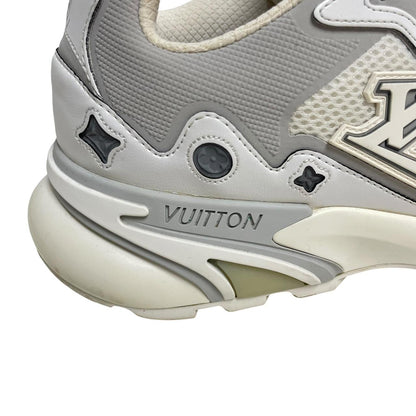Louis Vuitton white trainers with logo detailing and sleek design, pre-owned condition.