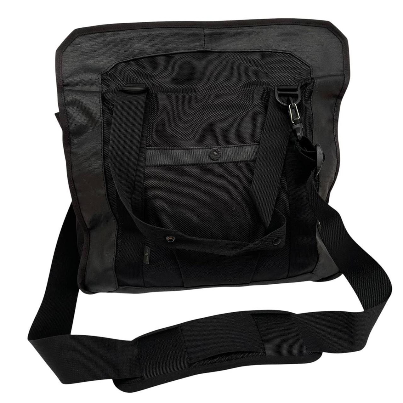Stone Island black nylon tote bag with logo patch and crossbody strap.