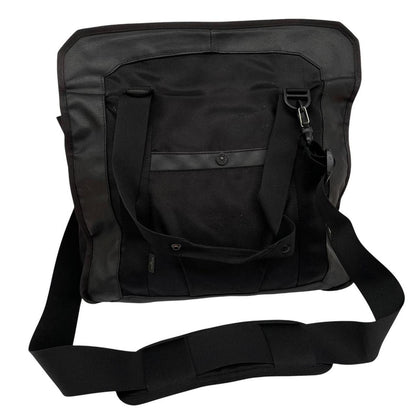 Stone Island black nylon tote bag with logo patch and crossbody strap.