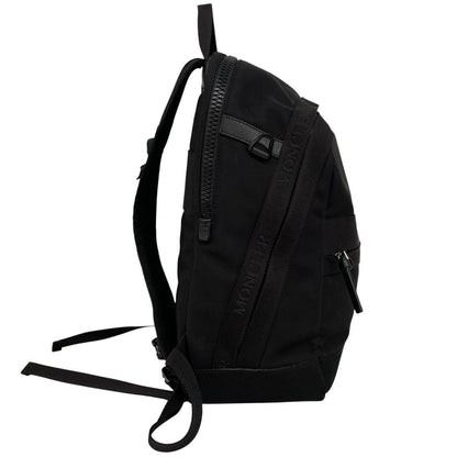 Moncler black duffel bag with logo patch and durable material, pre-loved condition.