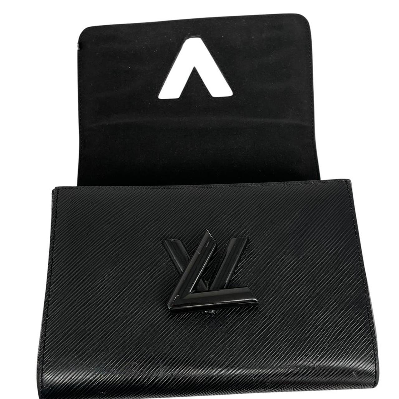 Louis Vuitton black Epi leather duffel bag with twist lock and visible wear.