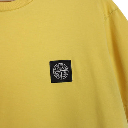 Stone Island yellow short sleeve cotton t-shirt with compass logo and soft fabric.