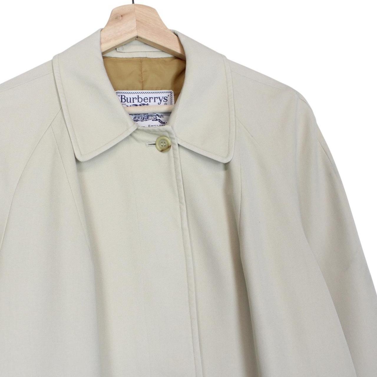 Burberry cream trench coat, single breasted, vintage 80s style, visible mark on sleeve.