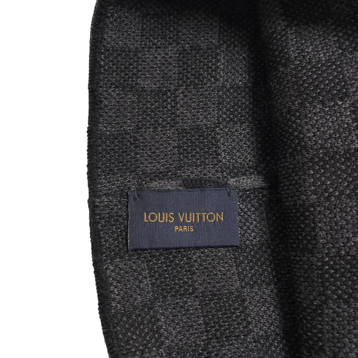 Louis Vuitton black and grey damier wool beanie with logo pattern.