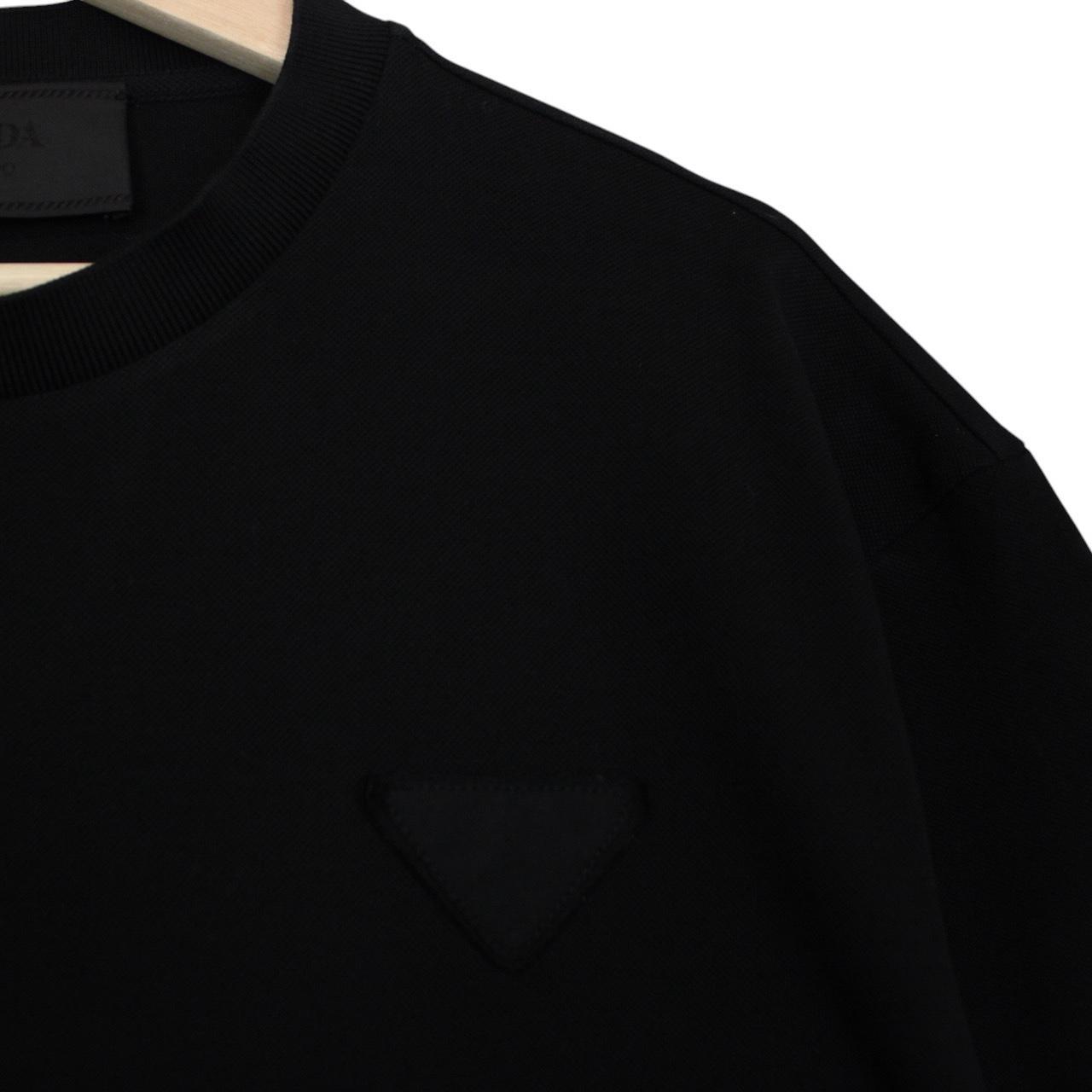 Prada black and white cotton short sleeve t-shirt with logo pocket detail.