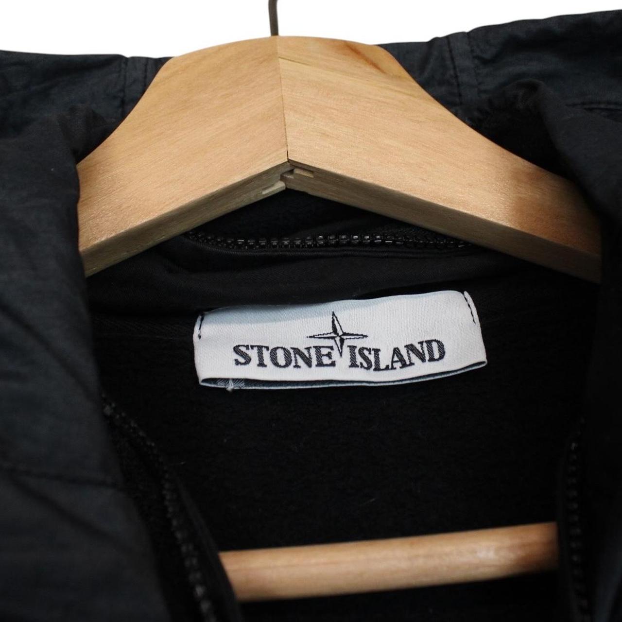 Stone Island black full zip hoodie with logo patch and cotton material.