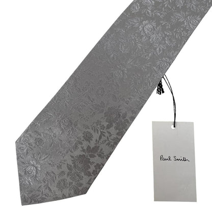 Paul Smith silver silk tie with floral print and brand logo detail.