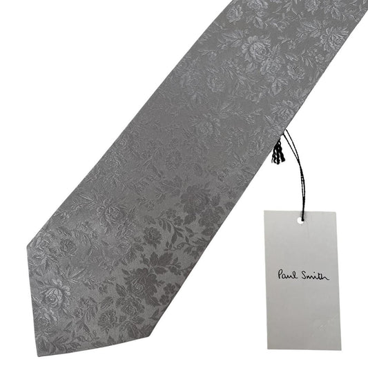 Paul Smith silver silk tie with floral print and brand logo detail.