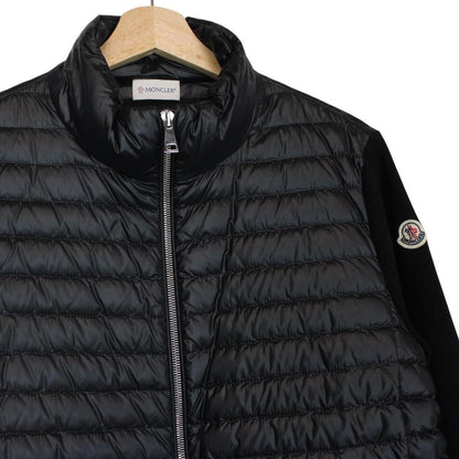 Moncler black cardigan jacket with full zip, down tricot material, and logo detail.