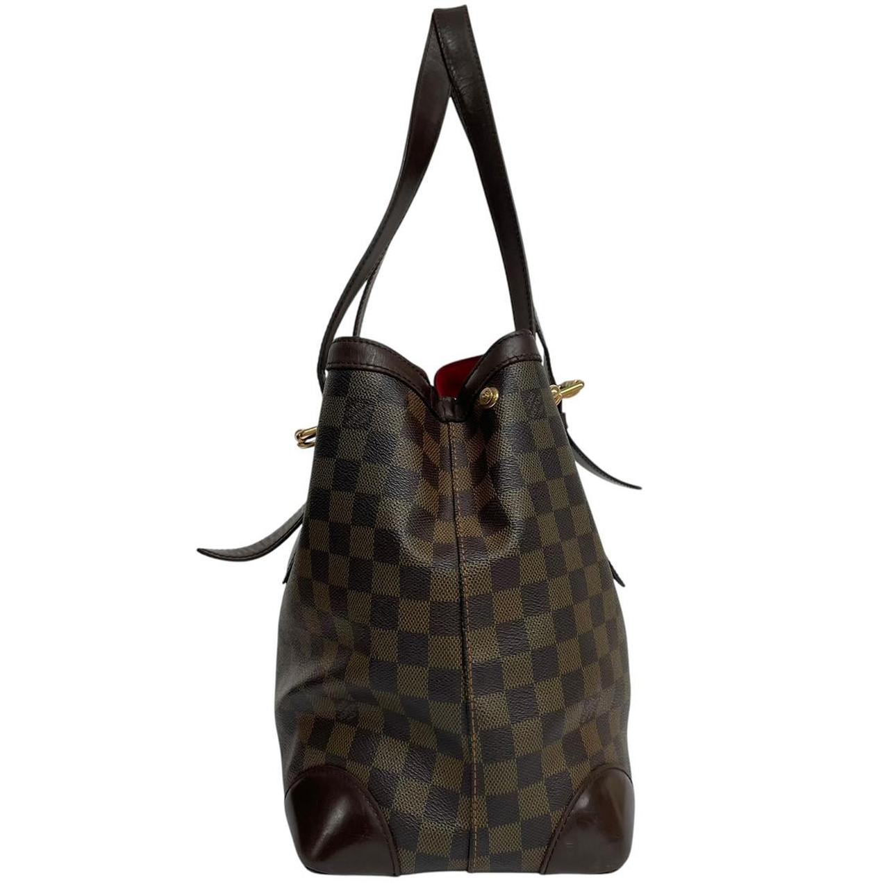 Louis Vuitton brown duffel bag with Damier Ebene pattern and logo plaque details.