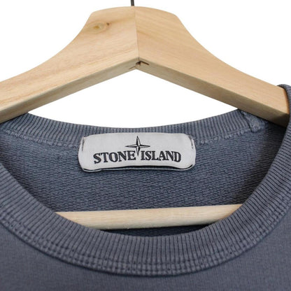 Stone Island blue cotton sweatshirt with iconic compass logo and ribbed cuffs.