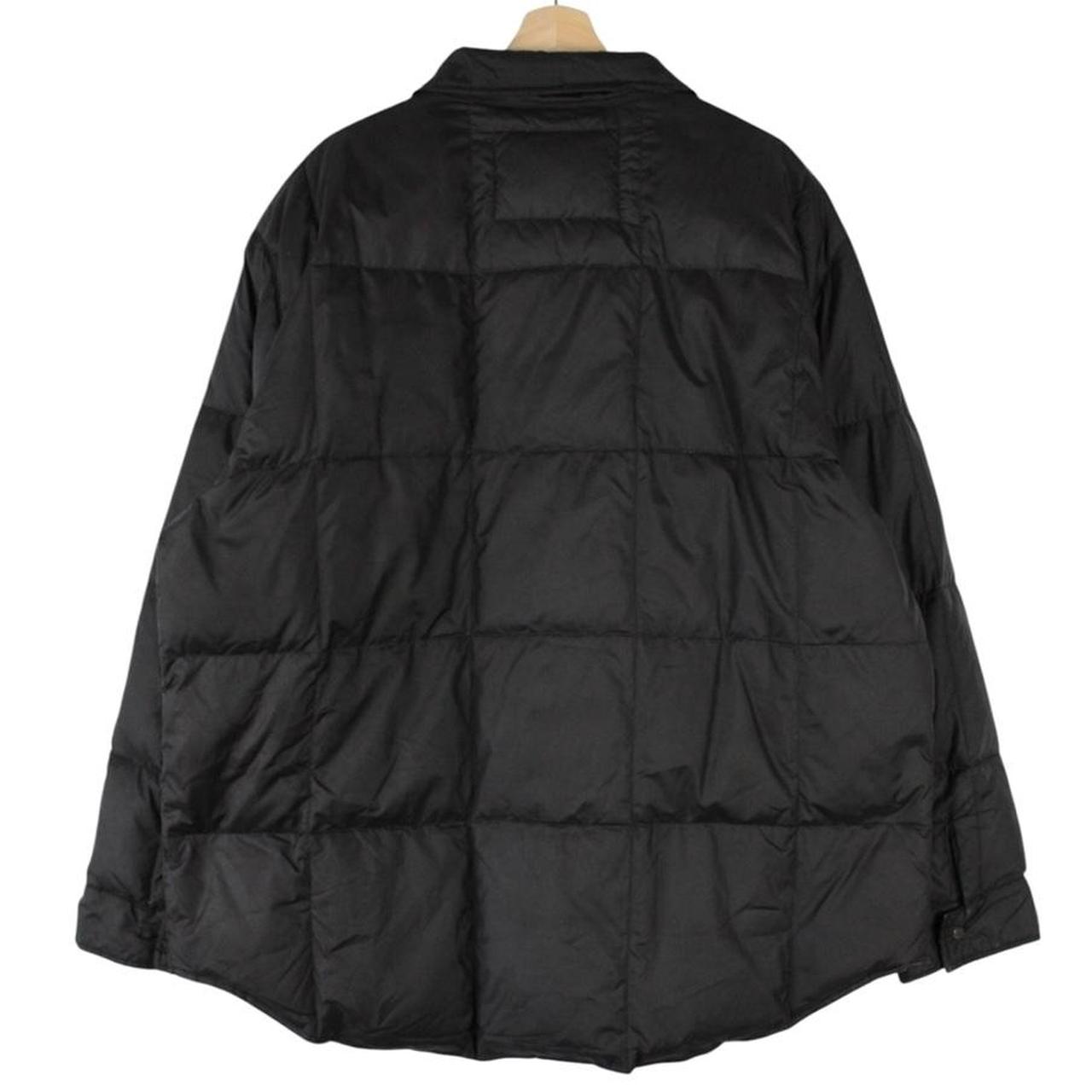Polo Ralph Lauren black down jacket with logo patch and oversized fit.