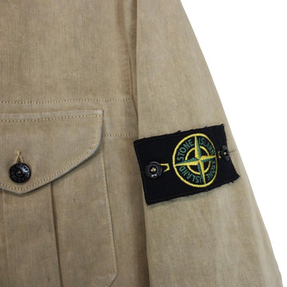 Stone Island beige multi-pocket jacket with logo patch and linen material.