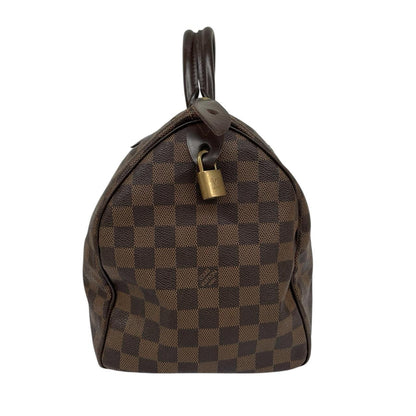 Louis Vuitton brown Damier Ebene canvas Speedy 35 bag with logo and gold-tone hardware.
