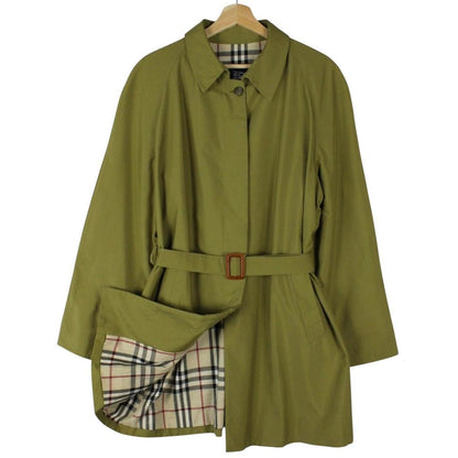 Burberry green trench coat with Nova Check pattern and belted waist detail.