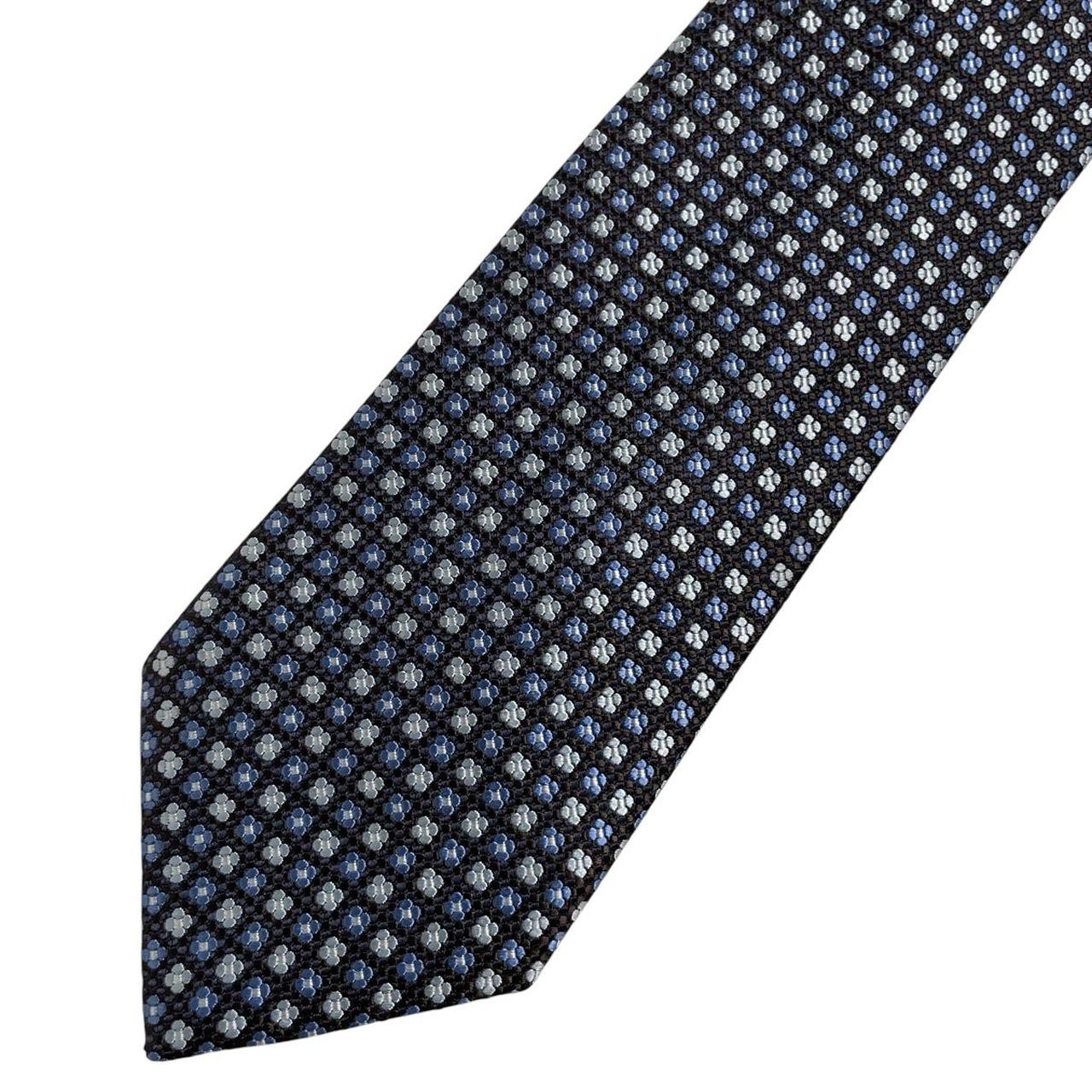 Ermenegildo Zegna blue silk tie with subtle sheen and logo detail.